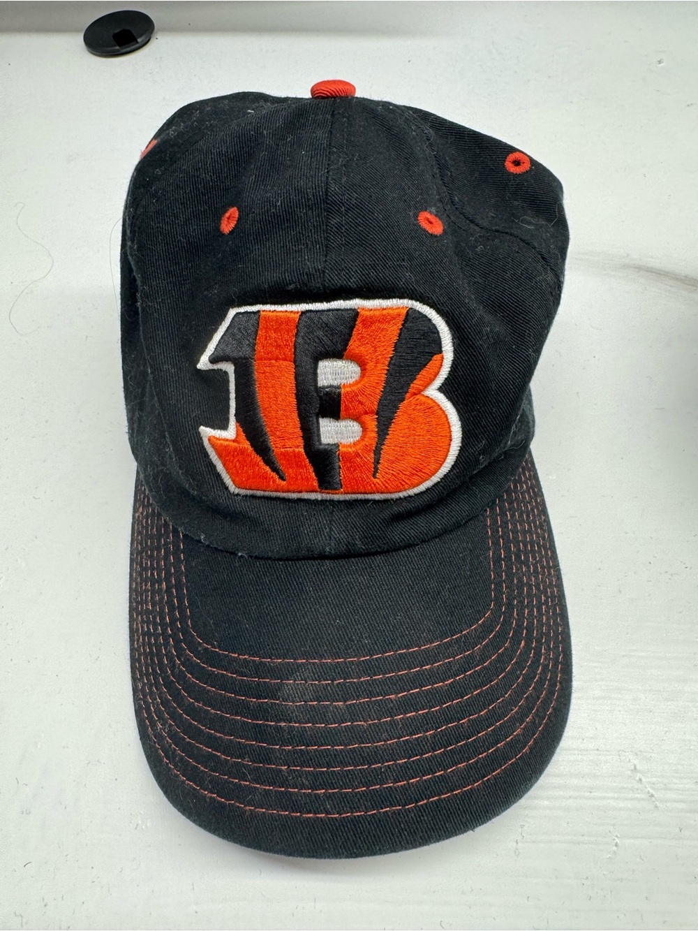 NFL Black Baseball Cap with Orange Eyelets